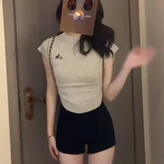 Black shorts for women in summer, with a full crotch and low waist to show off weight and long legs. Wearing them externally, in