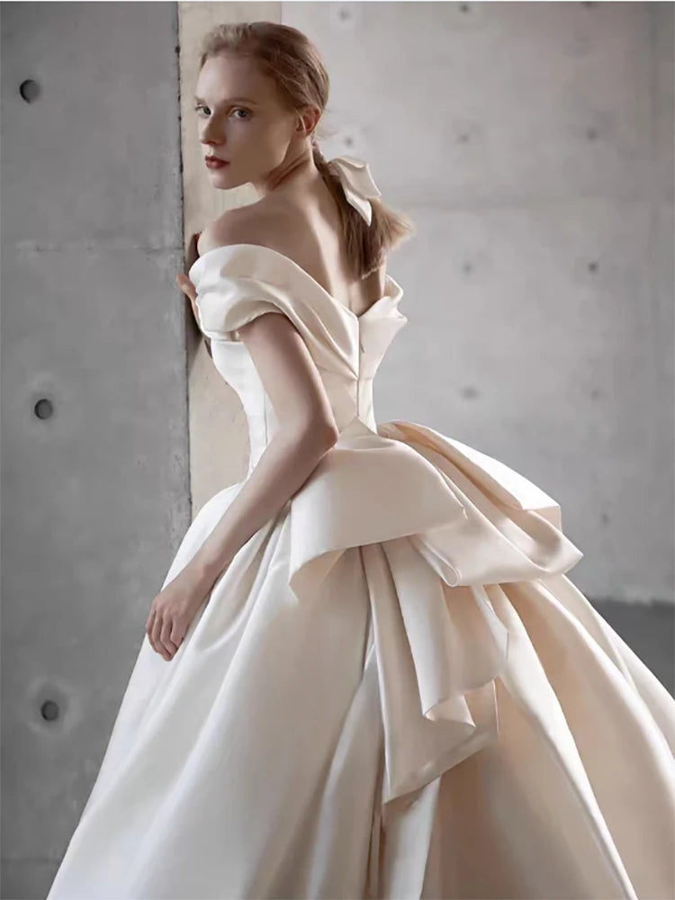 Elegant Satin Off-Shoulder Wedding Dress with Bow Detail