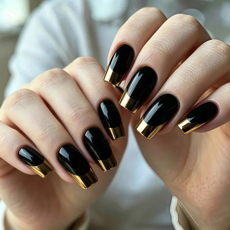 24PCS of false nails with a nude base coat and a shiny black surface and featuring a mirror-gold metallic French tip design