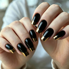 24PCS of false nails with a nude base coat and a shiny black surface and featuring a mirror-gold metallic French tip design