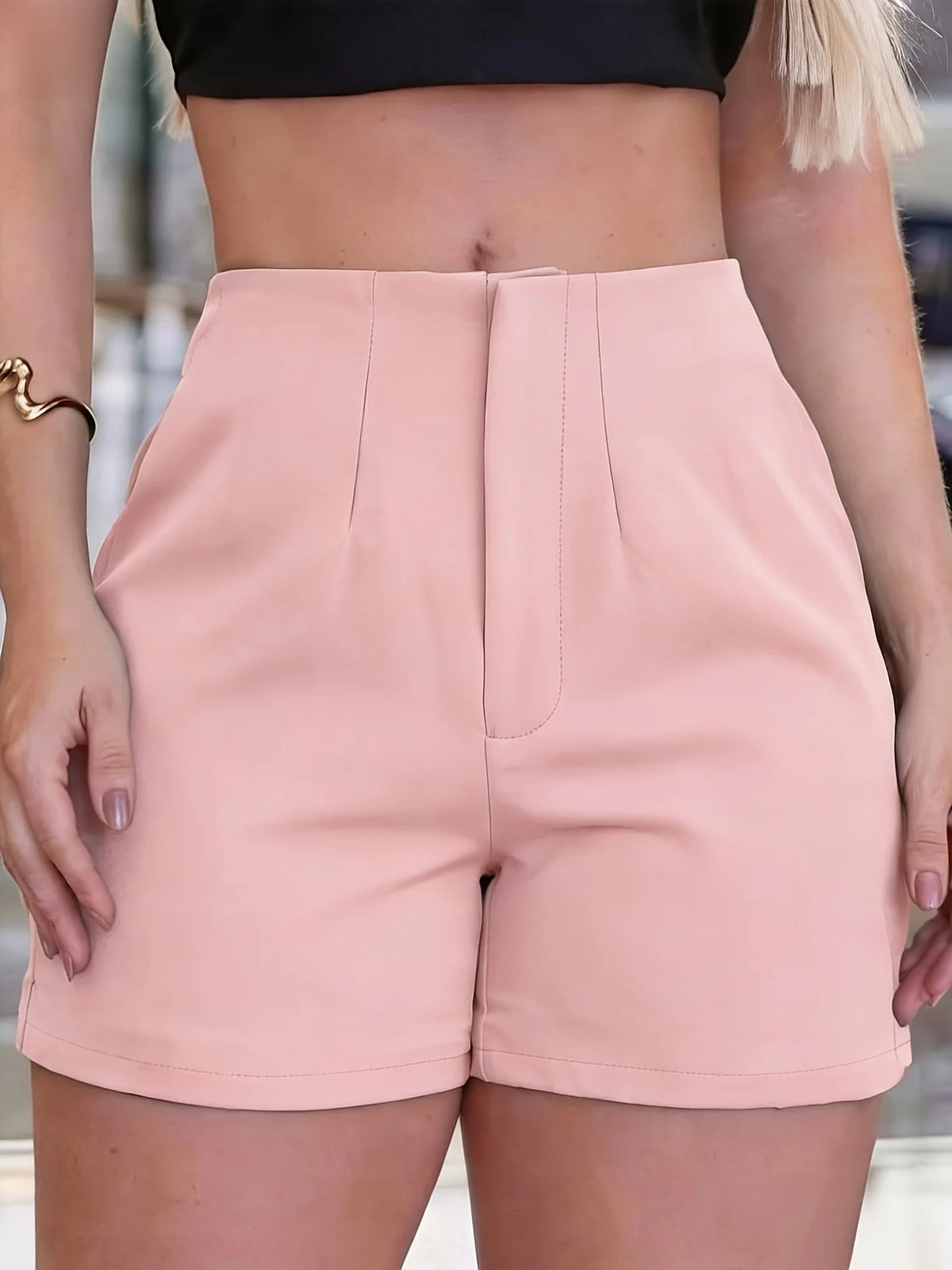 Women's black pleated shorts suitable for all seasons and commuting; side zipper for versatile style.