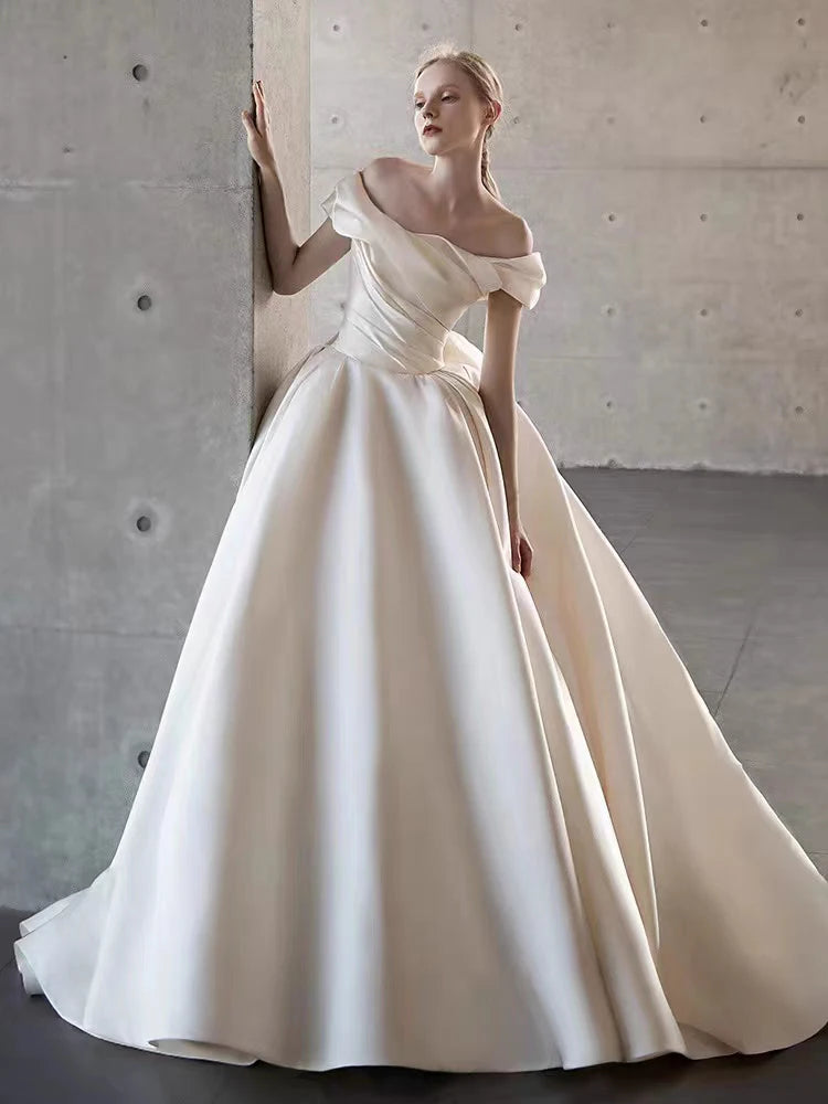 Elegant Satin Off-Shoulder Wedding Dress with Bow Detail