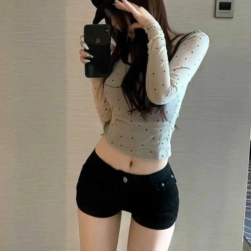 Black shorts for women in summer, with a full crotch and low waist to show off weight and long legs. Wearing them externally, in