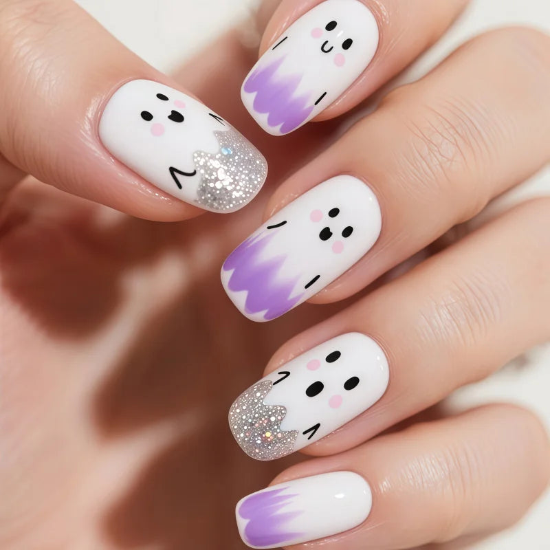 24PCS of false nails with a nude base coat and a shiny black surface and featuring a mirror-gold metallic French tip design